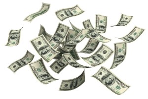 100 dollar bills up in the air